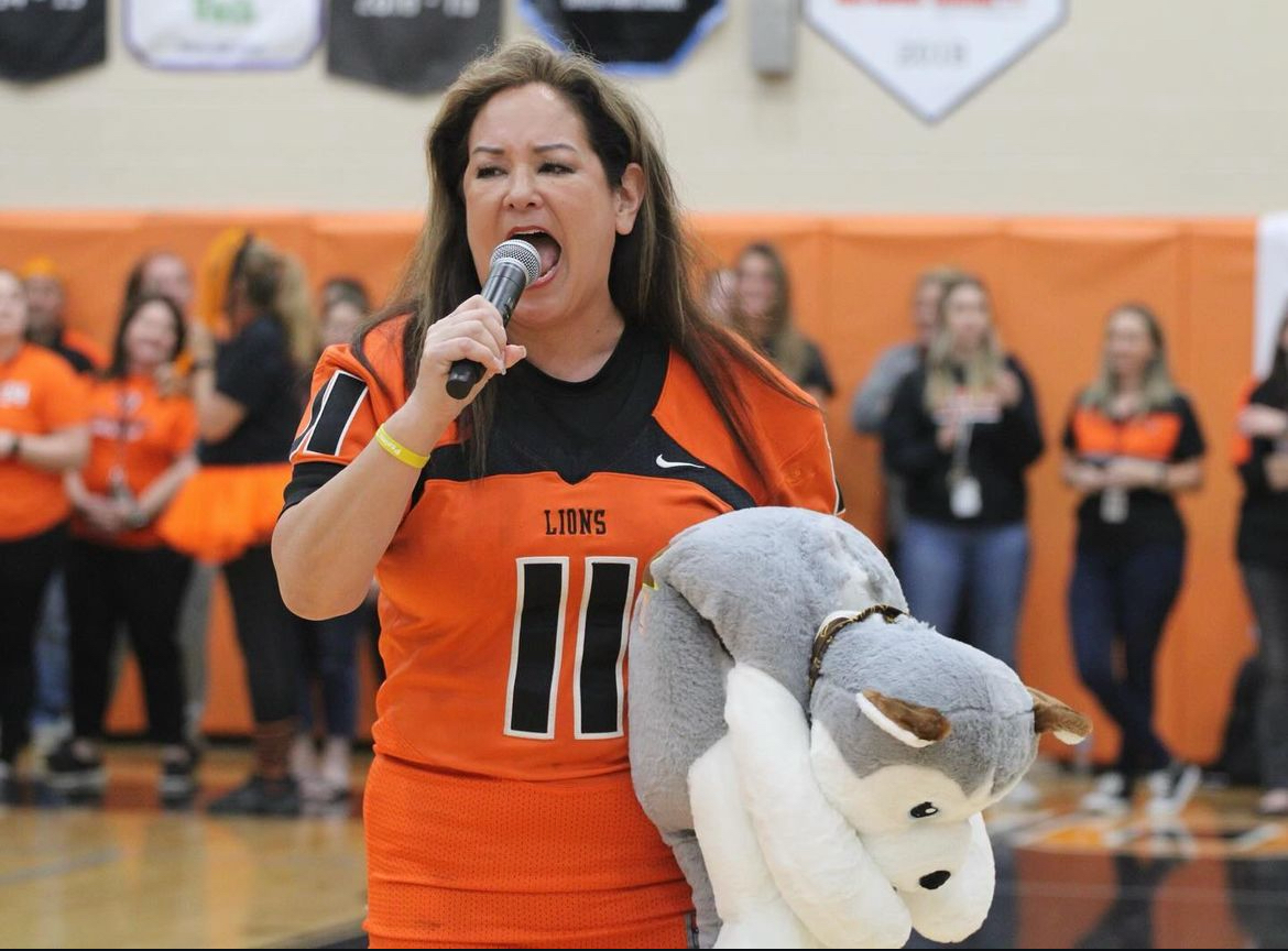 Dr. Daniel speaks to crowd of excited Oviedo high schoolers at the 2023 Hagerty pep rally. Minutes after this photo was taken, the stuffed Husky was torn apart at the pep rally. 